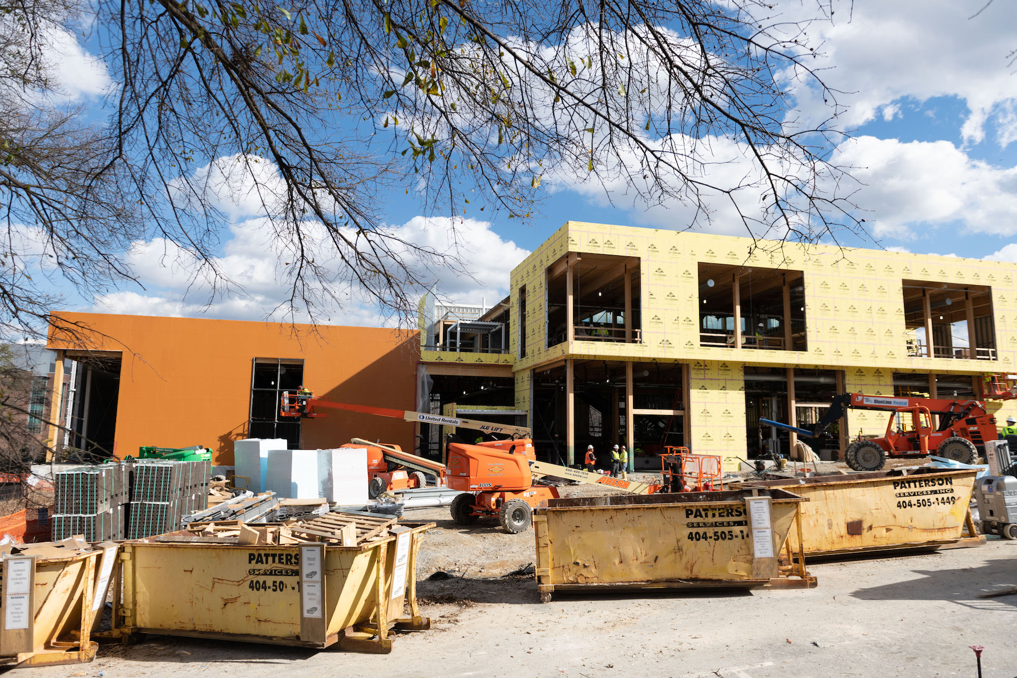 Teams working on The Kendeda Building are striving for net positive waste during construction. Seen here, materials are separated into recycling dumpsters.  