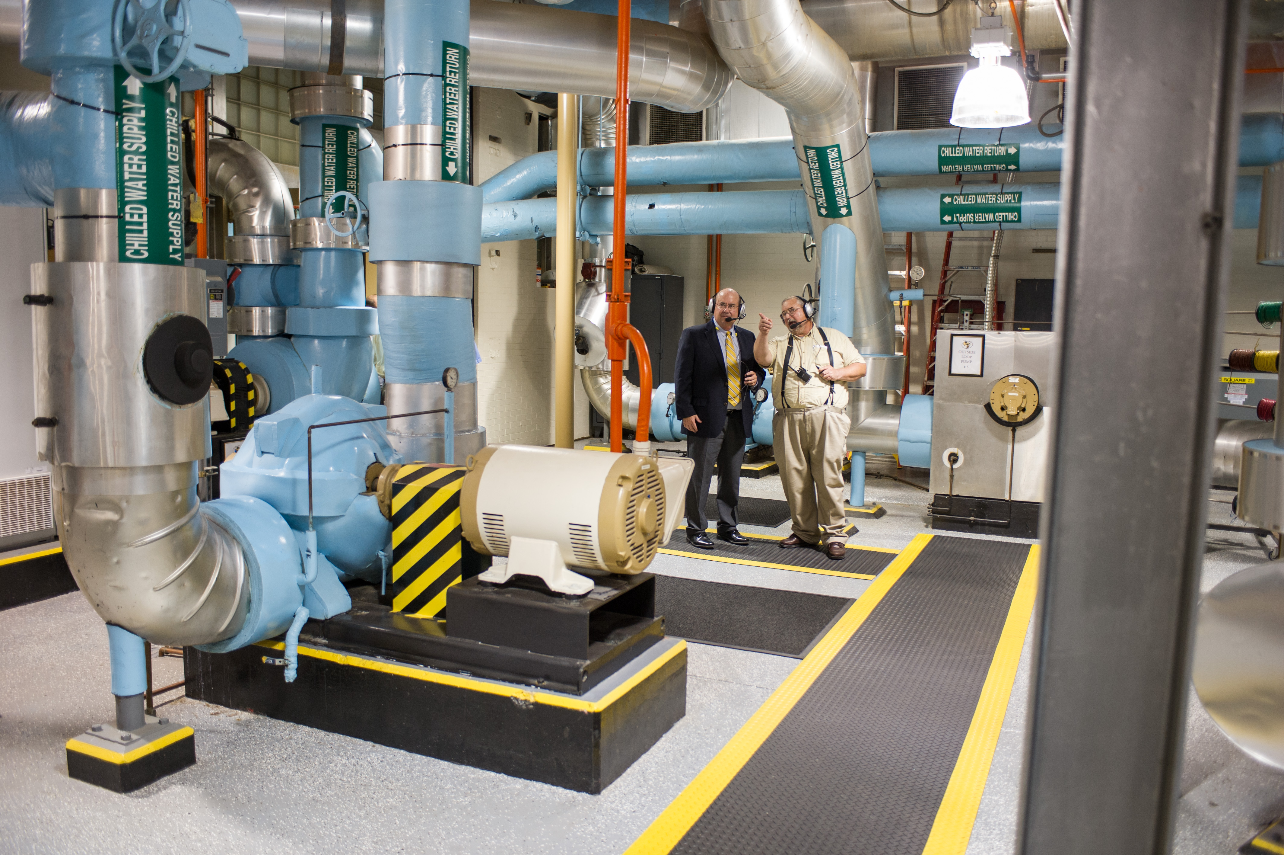 Steve Swant and Harold Cash tour the Holland Plant in 2014.